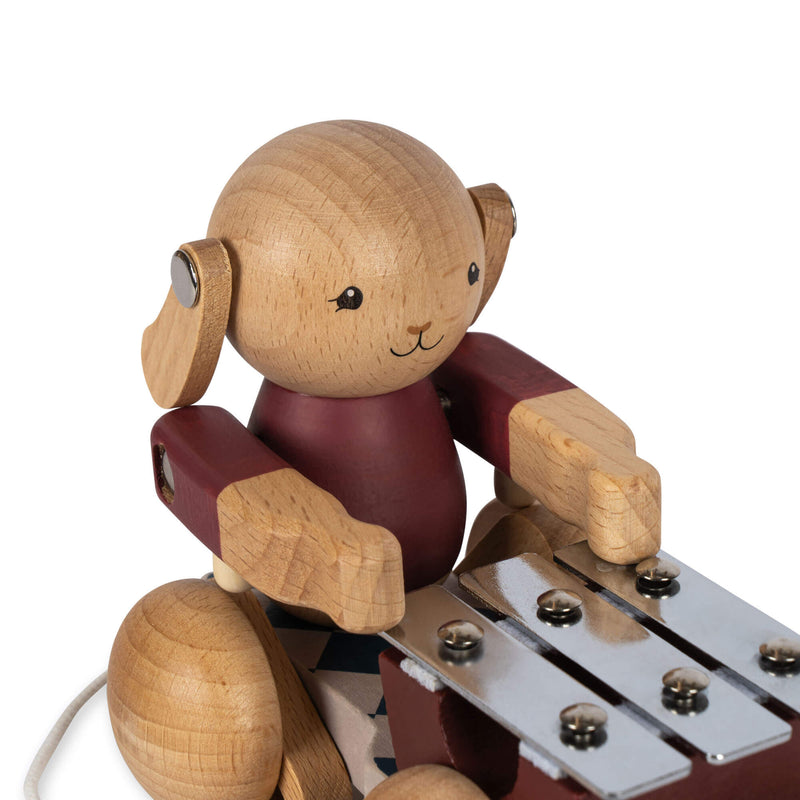 WOODEN PULL BUNNY MUSIC FSC-BELL BOY RED