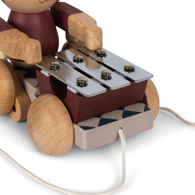 WOODEN PULL BUNNY MUSIC FSC-BELL BOY RED